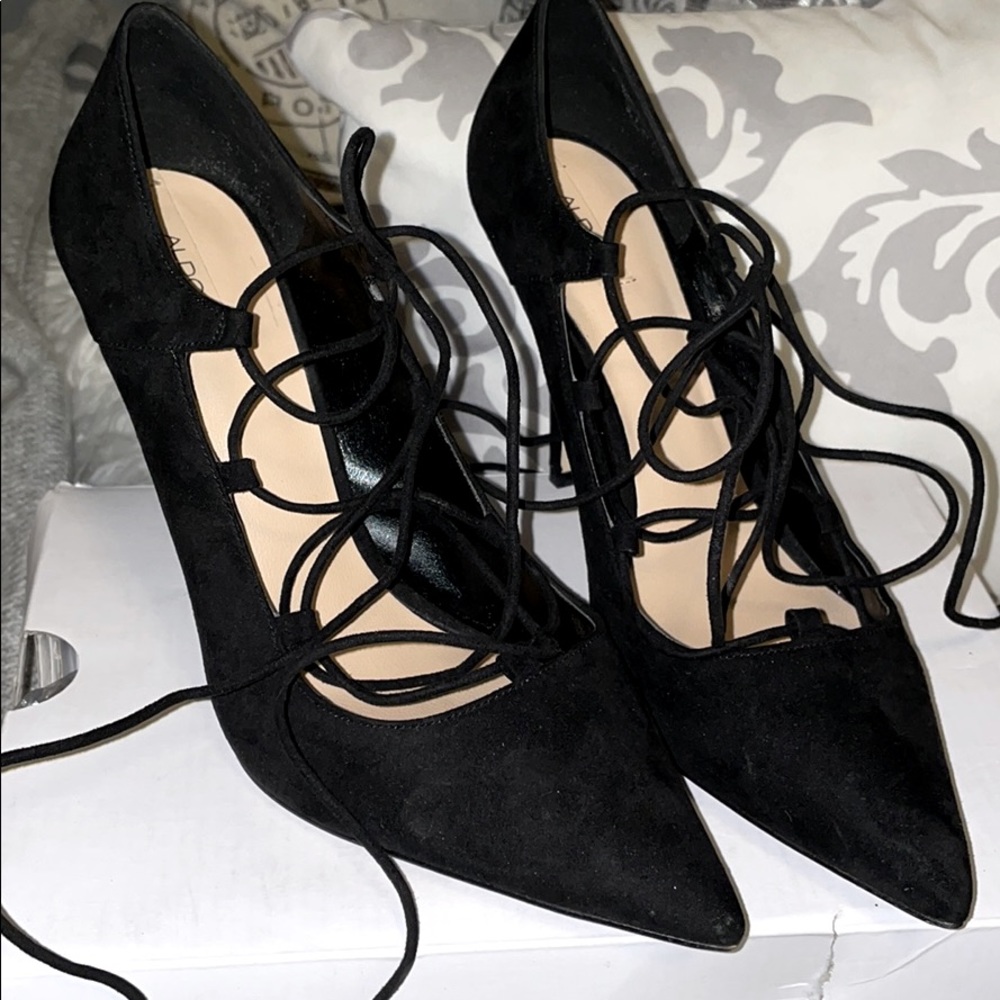 Black suede strap around heels